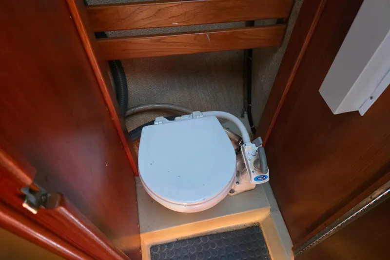 Slide: The Image of Compact marine toilet in 1985 Express Yachting Express 30 yacht bathroom. - 8
