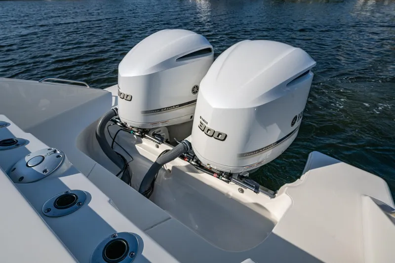 Slide: The Image of 2021 Pursuit S 288 Sport boat with dual Yamaha 300 outboard engines on water. - 20