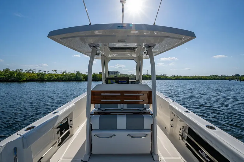 Slide: The Image of 2021 Pursuit S 288 Sport boat interior on a sunny day, overlooking calm waters. - 23