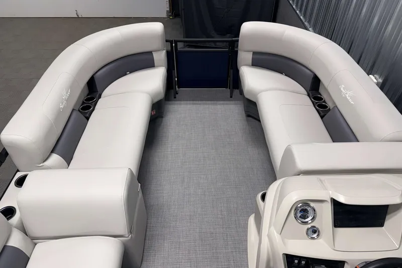 Slide: The Image of 2026 SunChaser Vista 16 LR pontoon boat interior with plush seating and modern dashboard. - 12