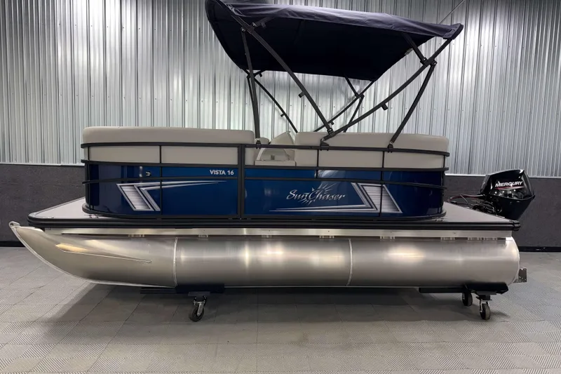 Slide: The Image of 2026 SunChaser Vista 16 LR pontoon boat with canopy and Mercury outboard motor. - 17