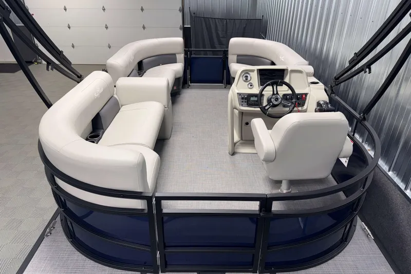 Slide: The Image of 2026 SunChaser Vista 16 LR pontoon boat interior with plush seating and modern helm. - 2
