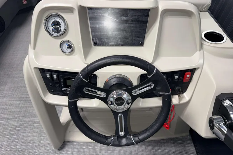 Slide: The Image of Steering console of 2026 SunChaser Vista 16 LR boat with gauges and controls. - 7