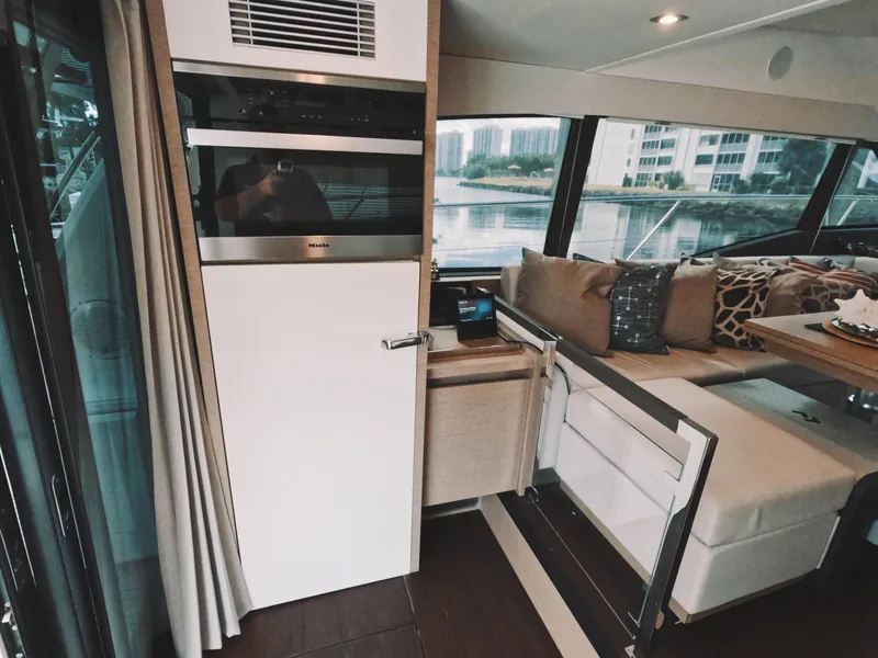 Slide: The Image of Luxurious interior of 2020 Prestige 460 yacht with modern seating and large windows. - 22