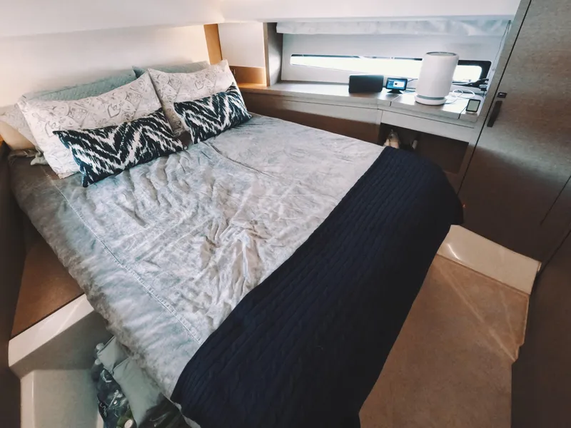 Slide: The Image of Luxurious bedroom interior of 2020 Prestige 460 yacht with modern bedding and decor. - 30