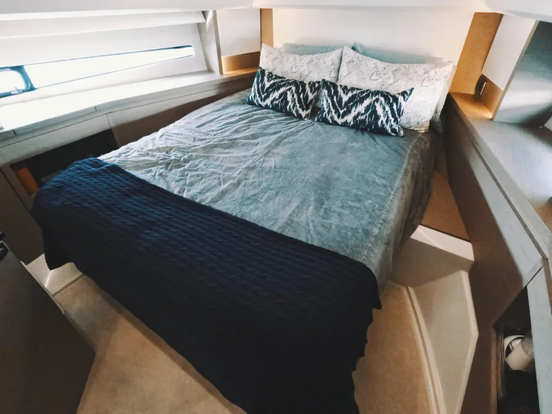 Slide: The Image of Luxurious bedroom interior of 2020 Prestige 460 yacht with cozy bedding. - 31