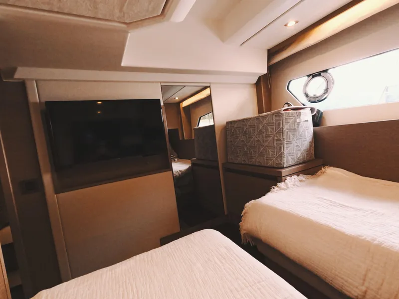 Slide: The Image of Interior of 2020 Prestige 460 yacht cabin with twin beds and modern decor. - 36