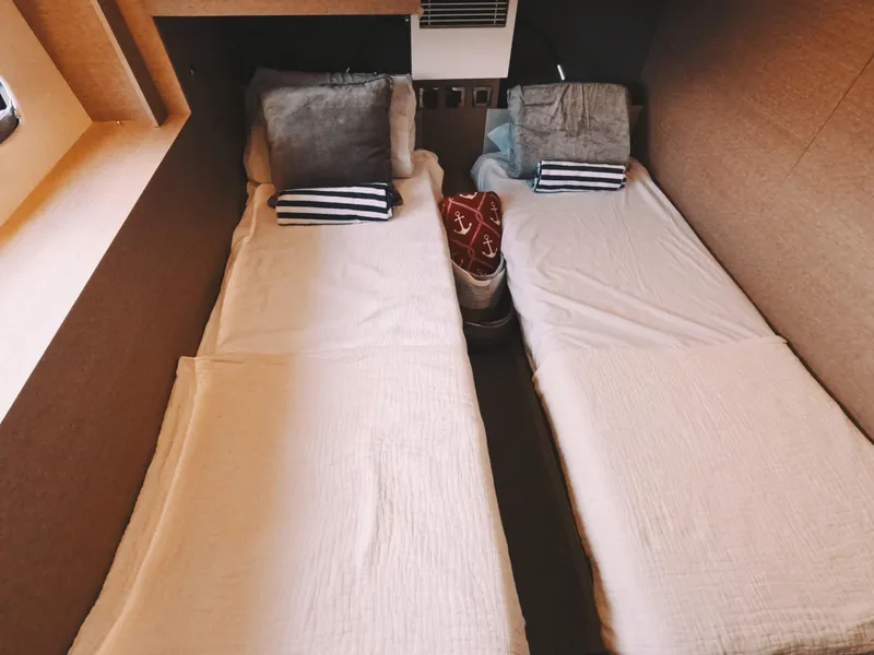 Slide: The Image of Twin beds in a 2020 Prestige 460 yacht cabin with cozy decor. - 37