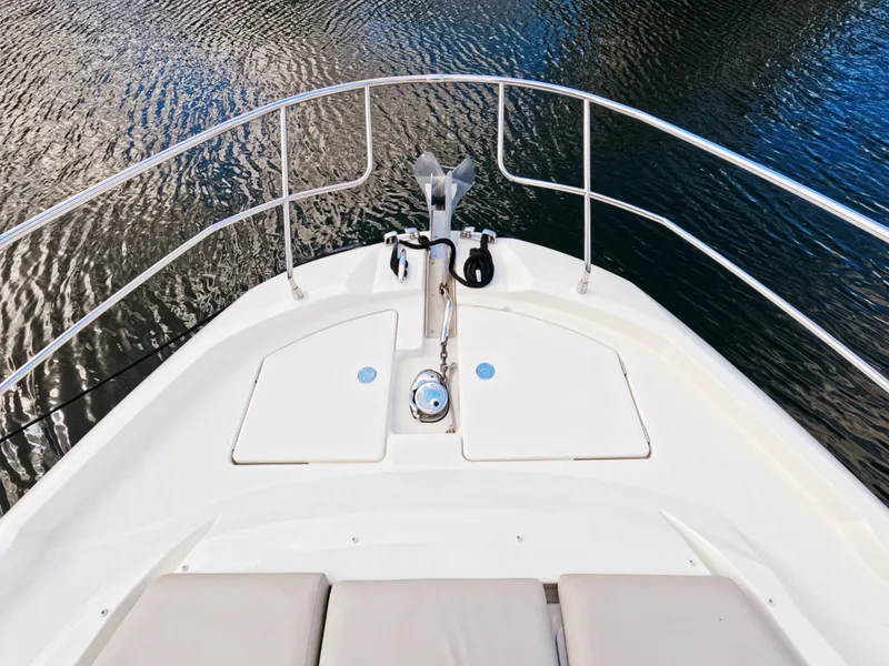 Slide: The Image of Prestige 460 yacht bow, 2020 model, with sleek white deck and railing. - 8