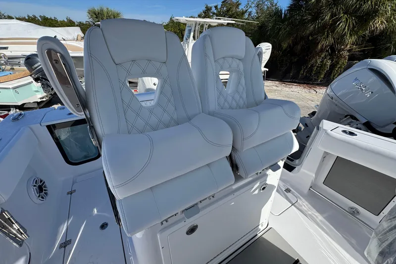 Slide: The Image of 2026 Sportsman Open 262 Center Console boat with luxurious seating and modern design. - 10