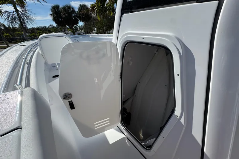 Slide: The Image of 2026 Sportsman Open 262 Center Console boat with open storage compartment. - 14