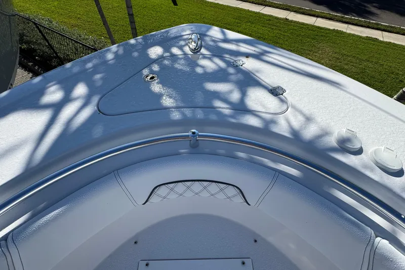 Slide: The Image of 2026 Sportsman Open 262 Center Console boat deck with sleek design and stainless steel railing. - 17