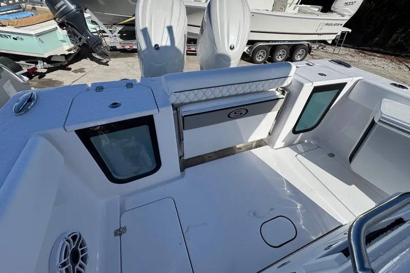 Slide: The Image of 2026 Sportsman Open 262 Center Console boat interior with seating and storage compartments. - 4