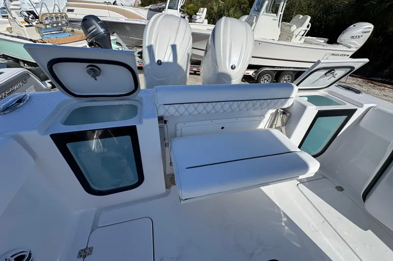 Slide: The Image of 2026 Sportsman Open 262 Center Console boat interior with seating and storage compartments. - 5