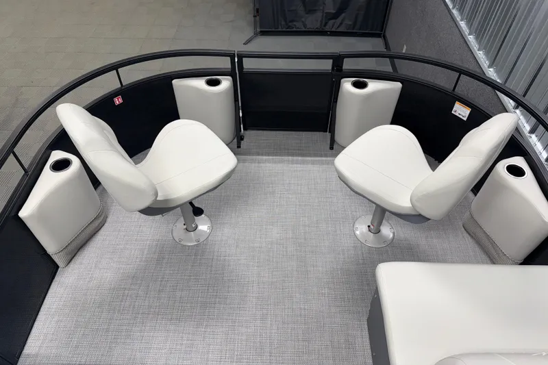 Slide: The Image of 2026 SunChaser Vista 16 Fish boat interior with swivel seats and cup holders. - 15