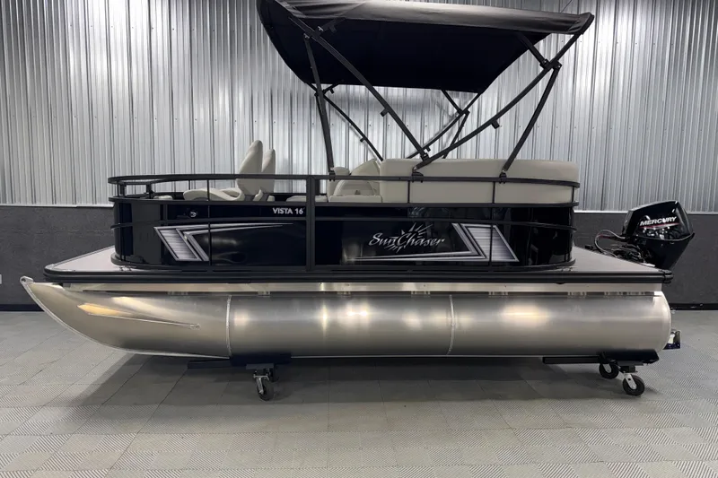 Slide: The Image of 2026 SunChaser Vista 16 Fish pontoon boat with canopy in showroom. - 20