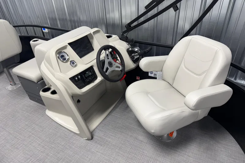 Slide: The Image of 2026 SunChaser Vista 16 Fish boat interior with steering console and plush captain's chair. - 5