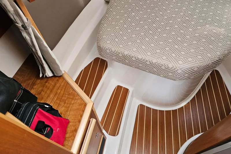 Slide: The Image of 2022 Cuwater C-32-CB interior with patterned seat and wooden flooring. - 17