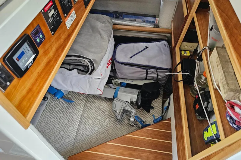 Slide: The Image of Storage area in a 2022 Cuwater C-32-CB boat with equipment and supplies. - 31
