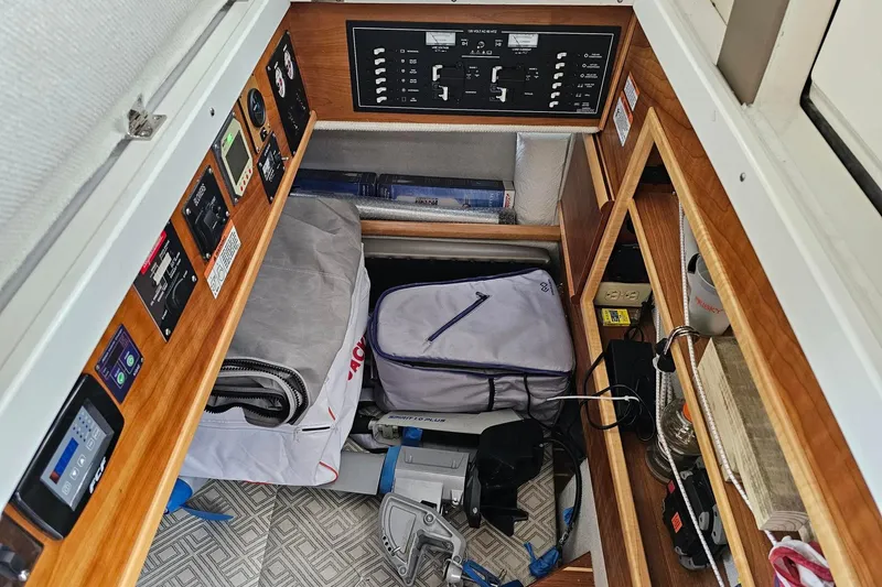 Slide: The Image of Interior of a 2022 Cuwater C-32-CB boat with storage and control panels. - 32