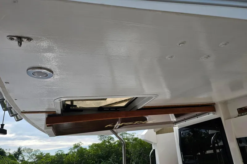 Slide: The Image of 2022 Cuwater C-32-CB boat interior ceiling with hatch and lighting. - 37
