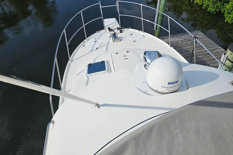 Slide: The Image of 2022 Cuwater C-32-CB boat deck with railing and satellite dome. - 46