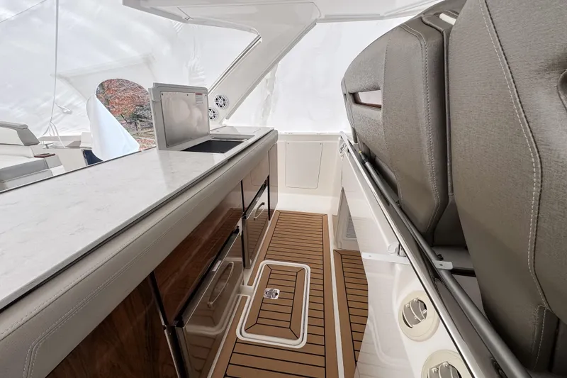 Slide: The Image of 2022 Tiara Yachts 43 LS interior with sleek countertops and elegant seating. - 10