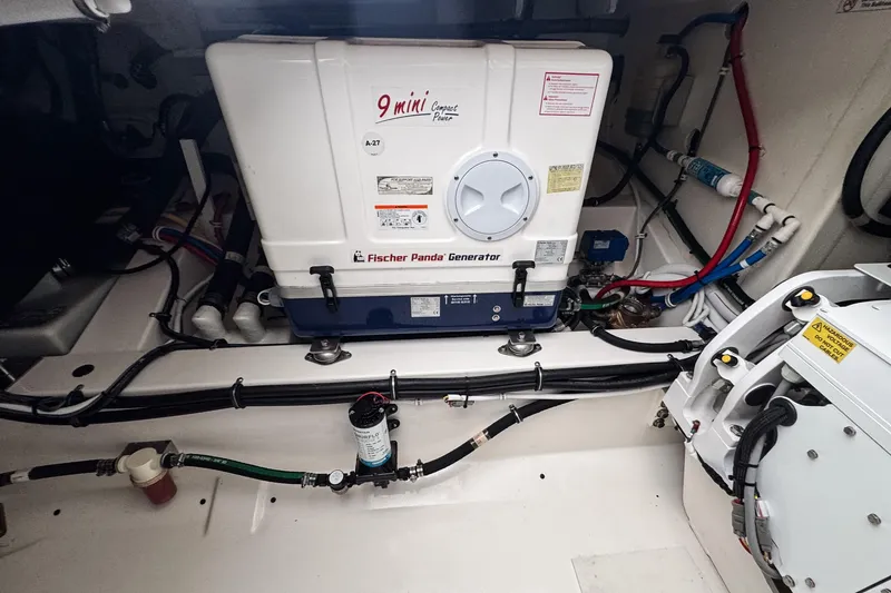 Slide: The Image of Engine room of 2022 Tiara Yachts 43 LS with Fischer Panda generator. - 22