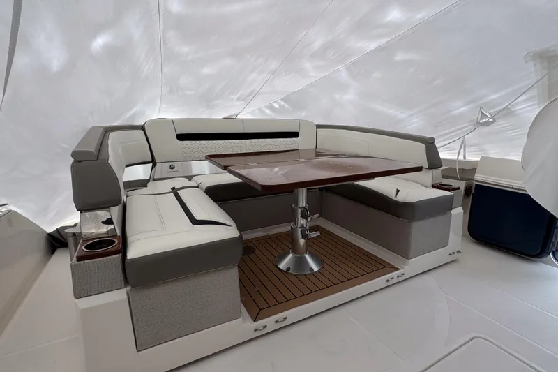 Slide: The Image of Luxurious seating area on 2022 Tiara Yachts 43 LS with elegant table and cushioned seats. - 5