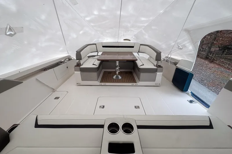 Slide: The Image of 2022 Tiara Yachts 43 LS interior with seating and table under canopy. - 9