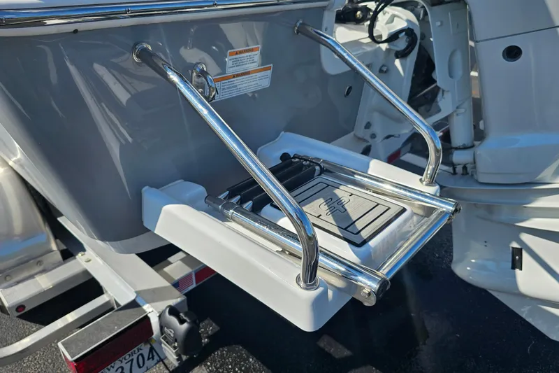 Slide: The Image of Trailer wheels of a 2025 Sea Pro 202 Center Console boat. - 11