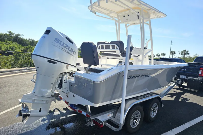 Slide: The Image of 2025 Sea Pro 202 Center Console boat on trailer in parking lot. - 7