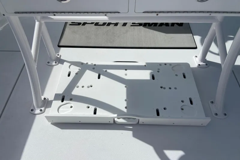 Slide: The Image of 2026 Sportsman Open 252 Center Console boat deck with storage compartment. - 14
