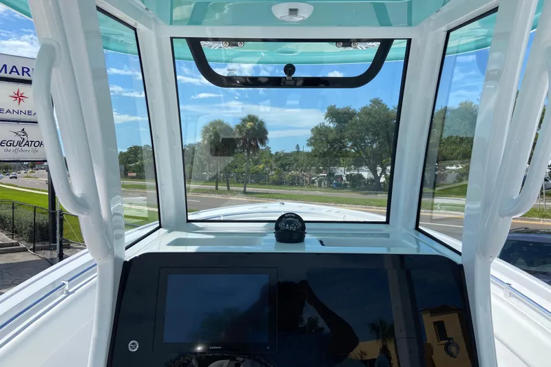 Slide: The Image of Interior view of 2026 Sportsman Open 252 Center Console boat with navigation equipment. - 21