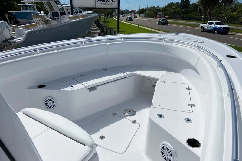 Slide: The Image of 2026 Sportsman Open 252 Center Console boat interior with seating and storage compartments. - 29