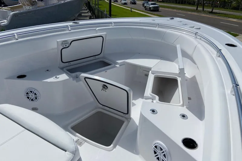 Slide: The Image of 2026 Sportsman Open 252 Center Console boat interior with storage compartments and seating. - 30