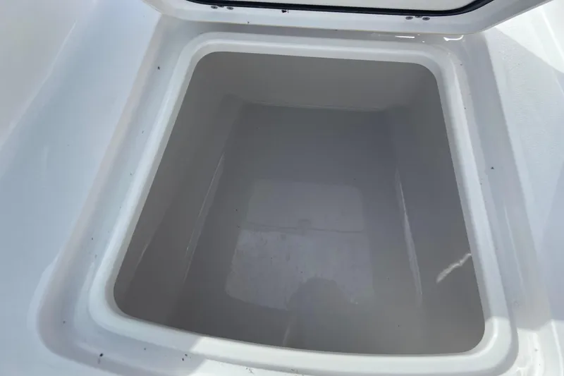 Slide: The Image of Open storage compartment of 2026 Sportsman Open 252 Center Console boat. - 31