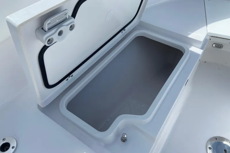 Slide: The Image of Open storage compartment on 2026 Sportsman Open 252 Center Console boat. - 33
