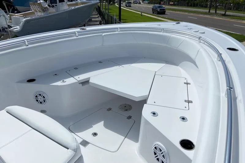 Slide: The Image of 2026 Sportsman Open 252 Center Console boat interior with seating and storage compartments. - 34