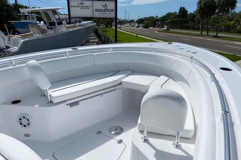 Slide: The Image of 2026 Sportsman Open 252 Center Console boat with white seating and sleek design. - 35