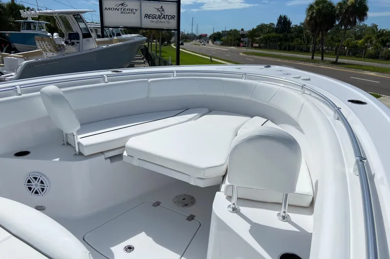 Slide: The Image of 2026 Sportsman Open 252 Center Console boat with white seating and sleek design. - 36