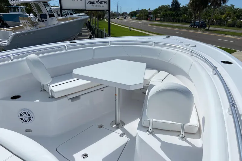 Slide: The Image of 2026 Sportsman Open 252 Center Console boat with spacious seating and table setup. - 37