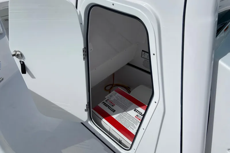 Slide: The Image of Open storage compartment on 2026 Sportsman Open 252 Center Console boat. - 41