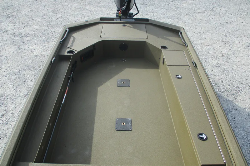 Slide: The Image of 2026 Avid 16 Commander boat interior with storage compartments and fishing rod holder. - 11