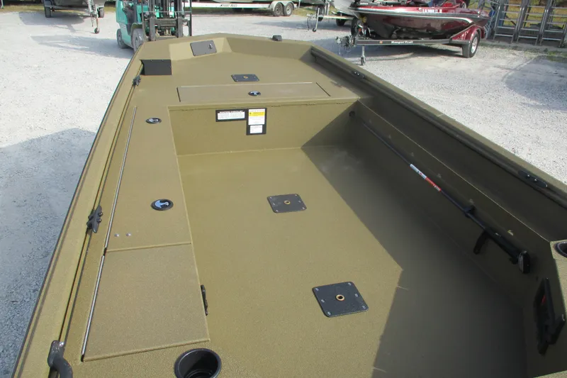 Slide: The Image of 2026 Avid 16 Commander boat interior with spacious deck and storage compartments. - 6