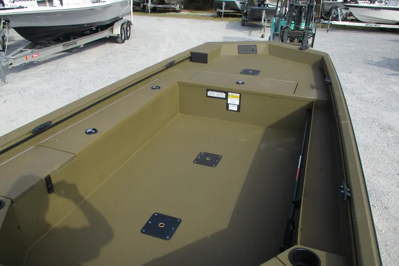 Slide: The Image of 2026 Avid 16 Commander boat interior with spacious deck and storage compartments. - 7