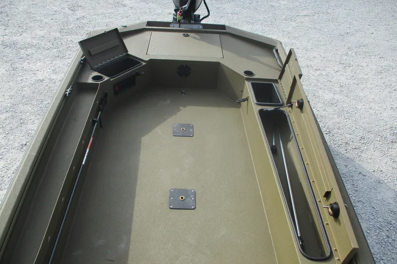 Slide: The Image of 2026 Avid 16 Commander boat interior with storage compartments and fishing rod holders. - 8