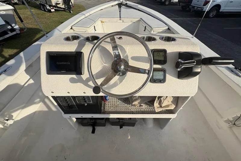 Slide: The Image of Steering console of a 2014 Reno 23 boat with Garmin navigation system. - 11