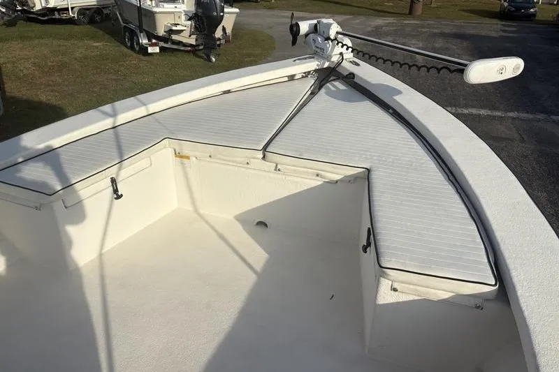 Slide: The Image of Bow area of a 2014 Reno 23 boat with seating and trolling motor. - 18