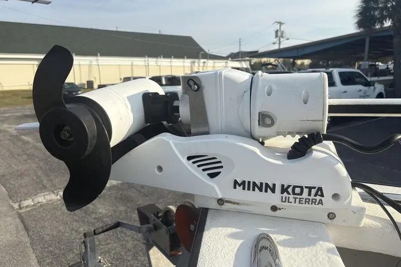 Slide: The Image of Minn Kota Ulterra trolling motor on Reno 23, 2014 model, in a parking lot. - 19